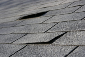 Loose shingles on a residential roof