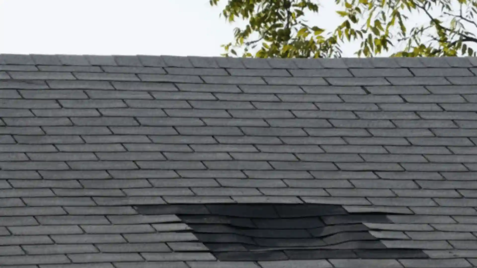 Missing roof shingles exposing underlayment causing heat loss and higher energy bills in Rochester MN