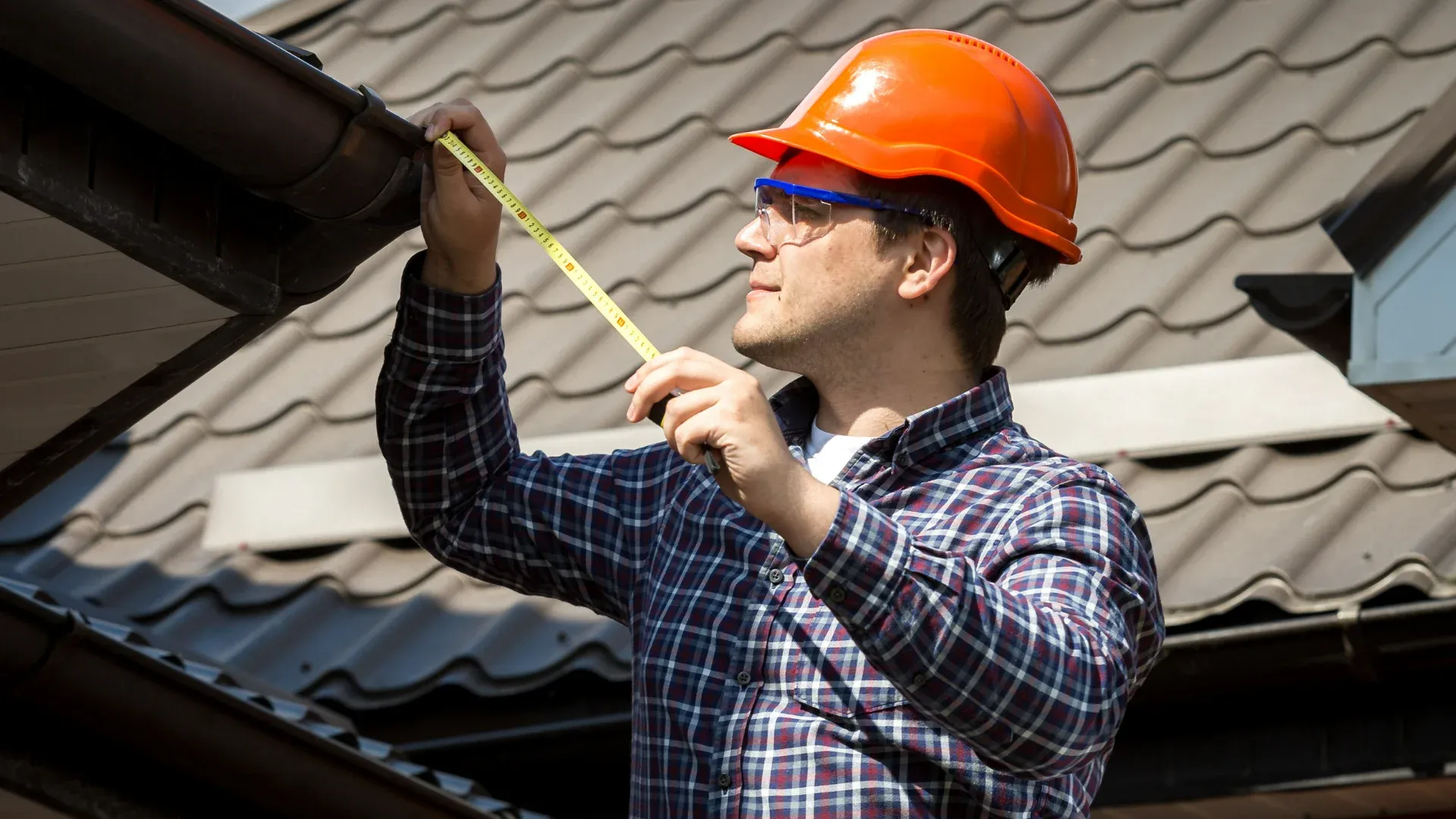 Roofing contractor performing a residential roof inspection